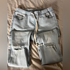 Jogger jeans ripped cut out.